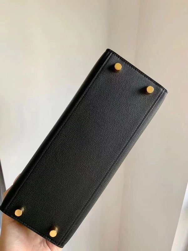 Side view of sculpted structured handbag