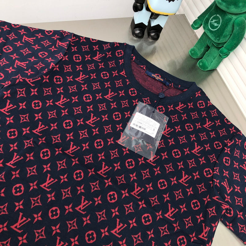Close-up detail shot of Louis Vuitton cotton t-shirt with label-forward styling