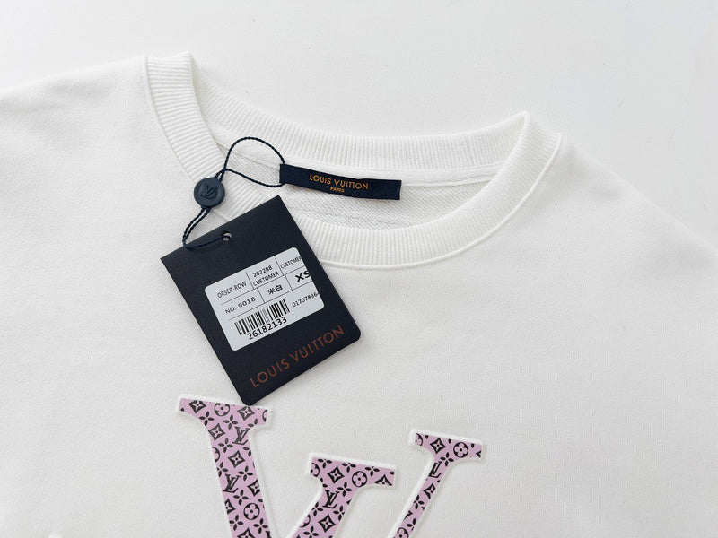 Flat lay presentation of Louis Vuitton luxury clothing with tailored silhouette