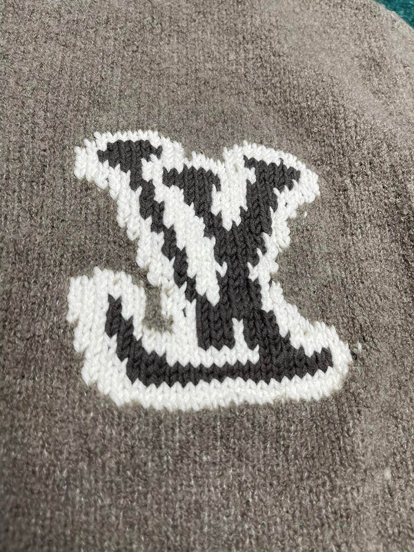 Close-up detail shot of Louis Vuitton luxury clothing with label-forward styling
