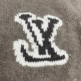 Close-up detail shot of Louis Vuitton luxury clothing with label-forward styling