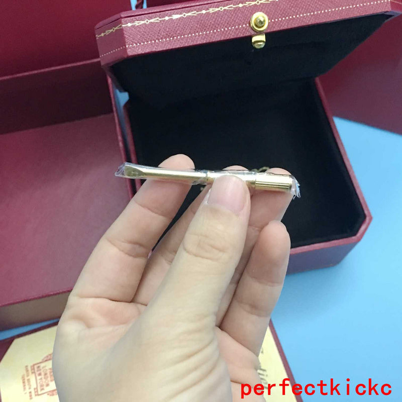 Side view of Cartier unisex jewelry piece