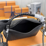  Understated crossbody bag carried on shoulder