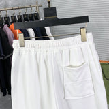 Back view of Rhude luxury clothing with logo-detail design