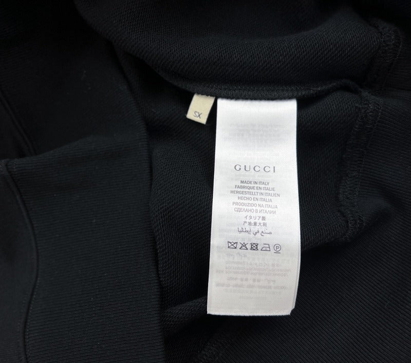 Side profile of Gucci luxury clothing with signature branding
