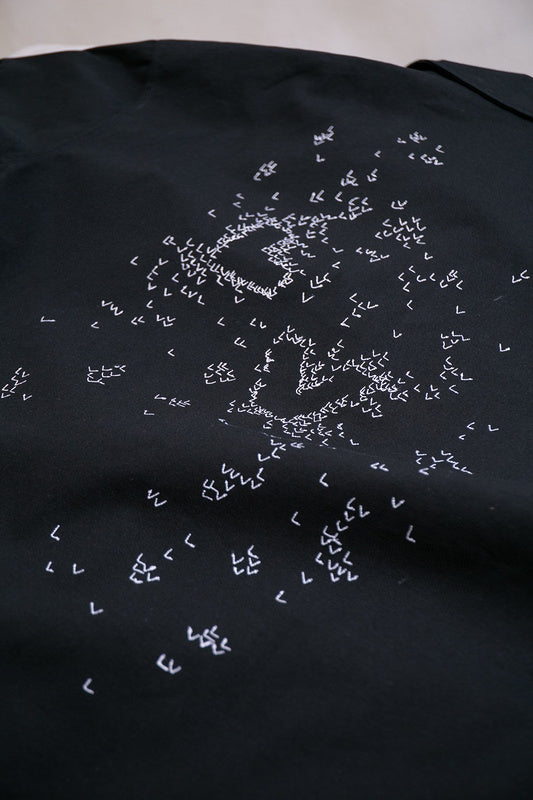Flat lay presentation of Louis Vuitton luxury clothing with streetwear-inspired cut