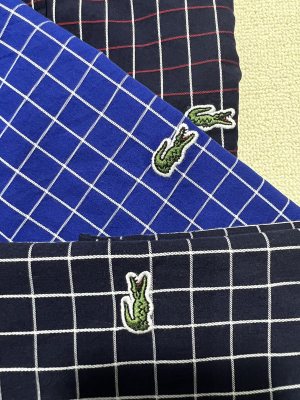 Back view of Lacoste luxury clothing with monogram-inspired silhouette