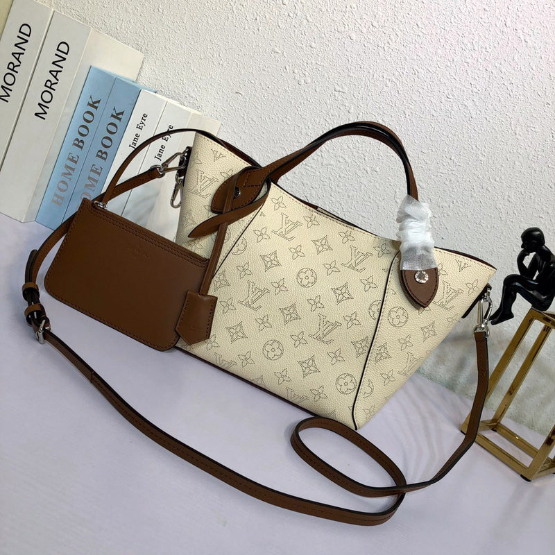 Side profile of signature elevated women's handbag – women's statement bag