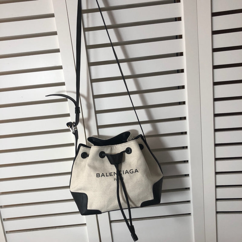 Side profile of statement structured women's handbag – women's luxury accessory