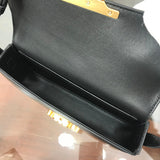 Handle and strap detail of chic sleek women's handbag – women's statement bag
