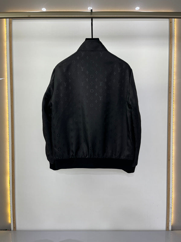 Close-up detail shot of Louis Vuitton luxury clothing with label-forward styling