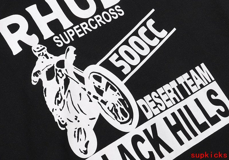 Close-up detail shot of Rhude luxury clothing with signature branding