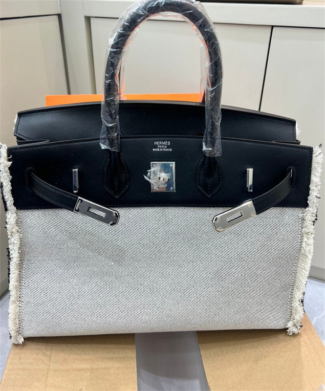 Side view of fluid structured handbag