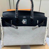 Side view of fluid structured handbag