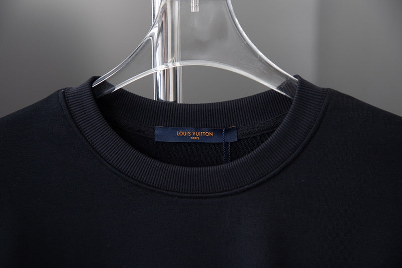 Close-up detail shot of Louis Vuitton luxury clothing with relaxed-fit cut