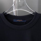 Close-up detail shot of Louis Vuitton luxury clothing with relaxed-fit cut