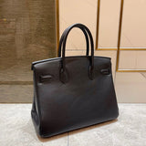 Side view of understated structured handbag