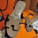 Hermès Black Flat Thong Sandals - Full Silhouette View