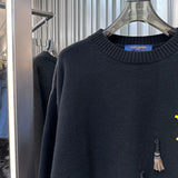 Close-up detail shot of Louis Vuitton luxury clothing with streetwear-inspired cut