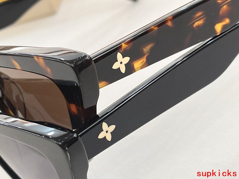 Close-up detail view of Louis Vuitton unisex sunglasses