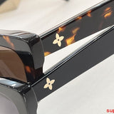 Close-up detail view of Louis Vuitton unisex sunglasses