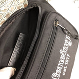 Side profile of structured polished women's handbag – women's luxury handbag