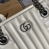 Back view of modern polished women's handbag – women's luxury accessory