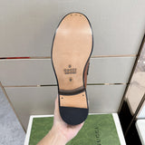 Side profile of Gucci fresh white-and-black sneakers streetwear statement look