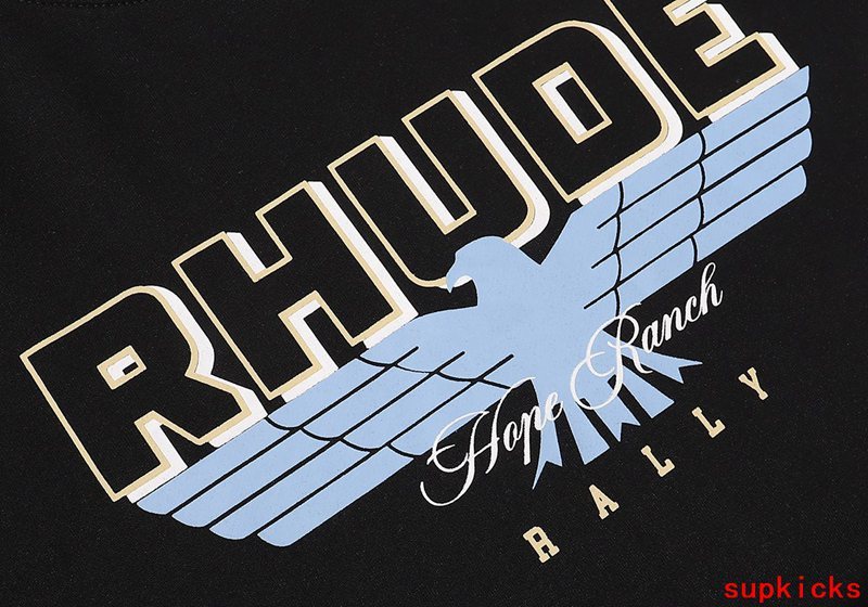 Close-up detail shot of Rhude luxury clothing with signature branding