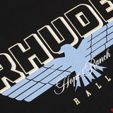 Close-up detail shot of Rhude luxury clothing with signature branding
