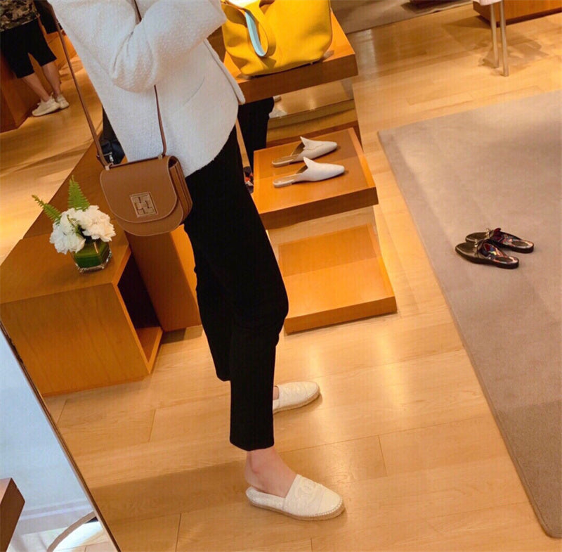 Side view of fluid structured handbag