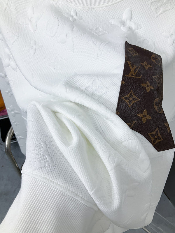 Front view of Louis Vuitton luxury clothing with label-forward styling
