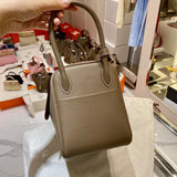 Side view of streamlined structured handbag
