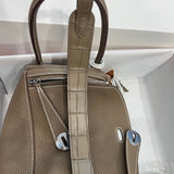 Side view of effortless structured handbag
