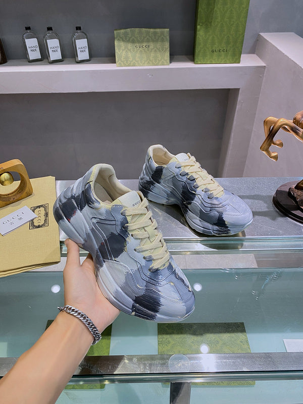 Side profile of Gucci soft grey sneakers bold athletic profile