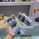 Side profile of Gucci soft grey sneakers bold athletic profile