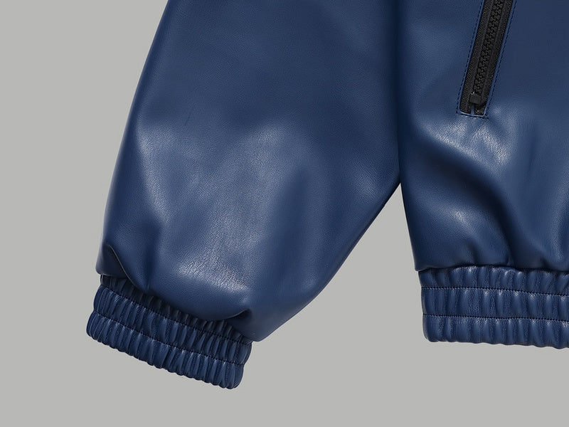 Close-up detail shot of Louis Vuitton luxury clothing with monogram-inspired silhouette