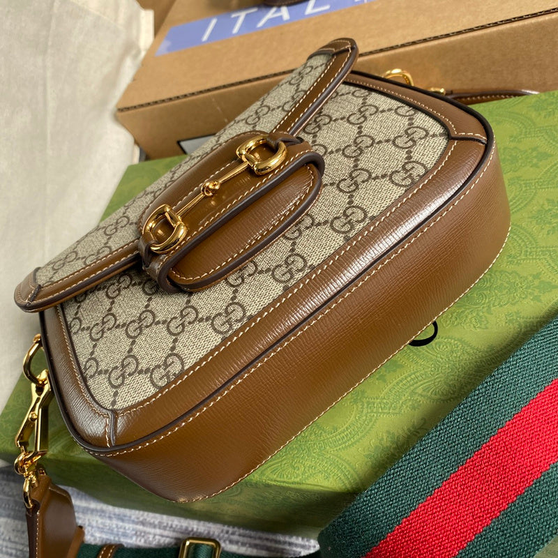 Side profile of structured statement women's handbag – women's luxury accessory