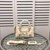 Side profile of statement everyday-luxe women's handbag – women's statement bag