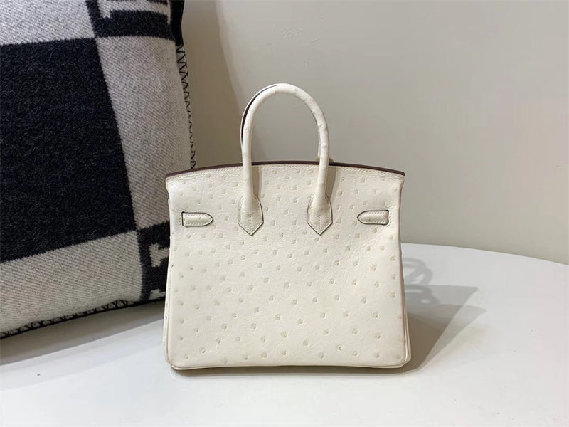 Side view of clean-lined structured handbag