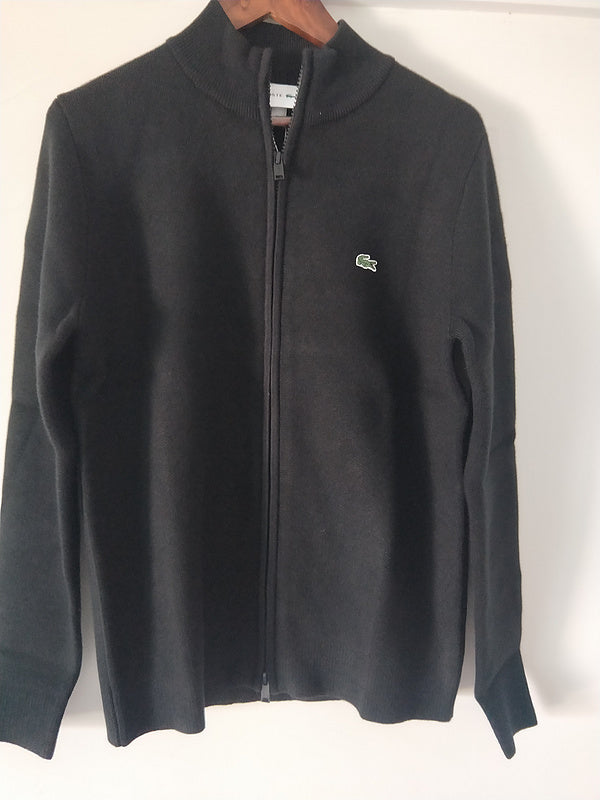 Front view of Lacoste luxury clothing with monogram-inspired silhouette