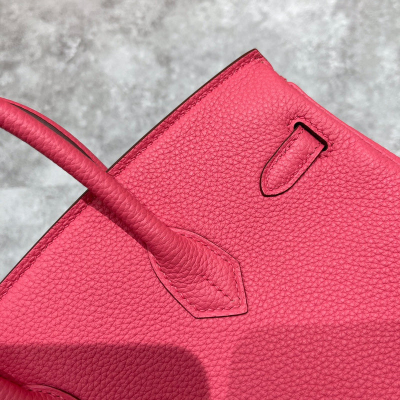 Side view of tailored structured handbag