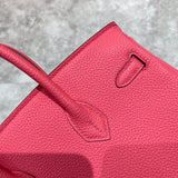 Side view of tailored structured handbag