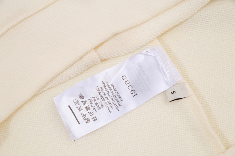 Close-up detail shot of Gucci luxury clothing with streetwear-inspired cut
