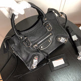 Front view of elevated polished women's handbag – women's luxury accessory