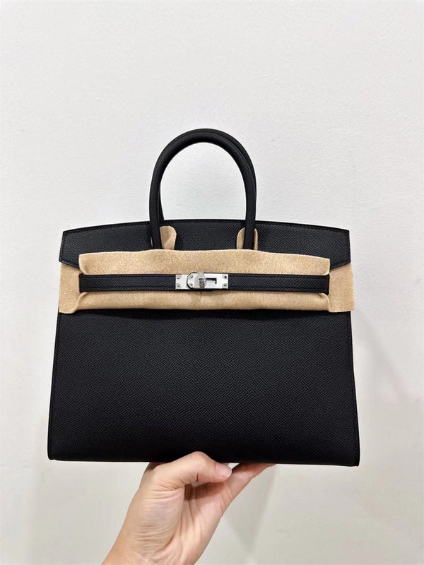 Side view of refined structured handbag