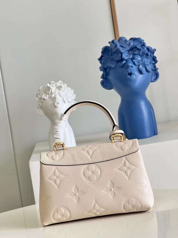 Handle and strap detail of everyday-luxe sleek women's handbag – women's luxury handbag
