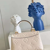Handle and strap detail of everyday-luxe sleek women's handbag – women's luxury handbag