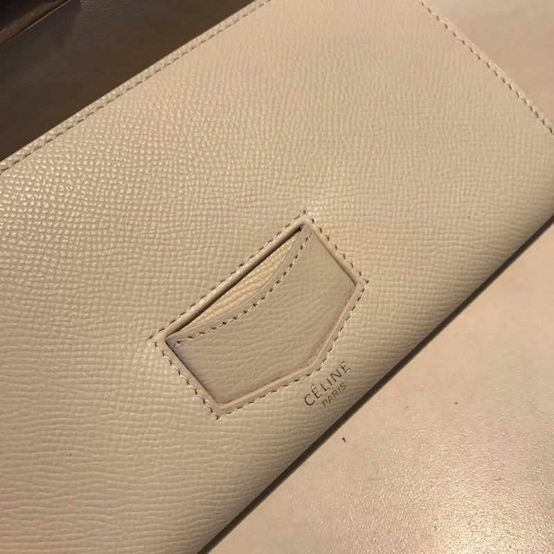 Side profile of premium polished women's handbag – women's designer-style accessory