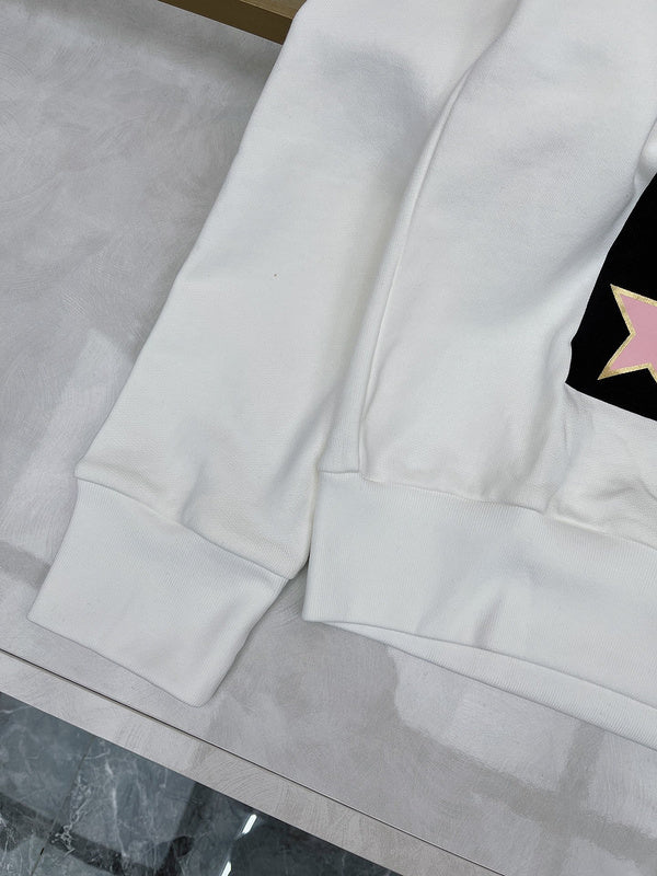Flat lay presentation of Gucci luxury clothing with logo-detail design